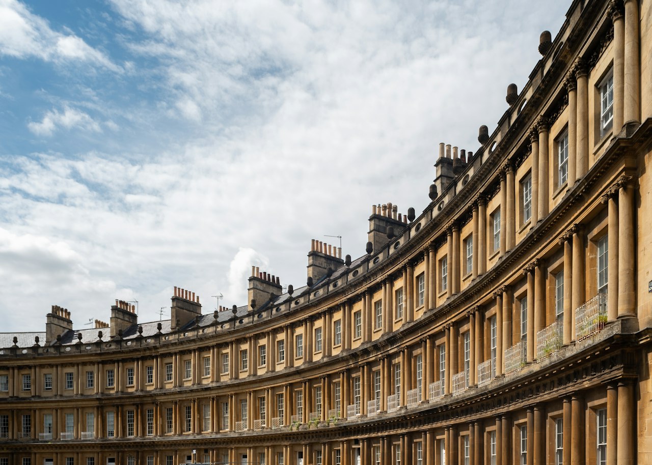 A curved building with a blue sky in the background